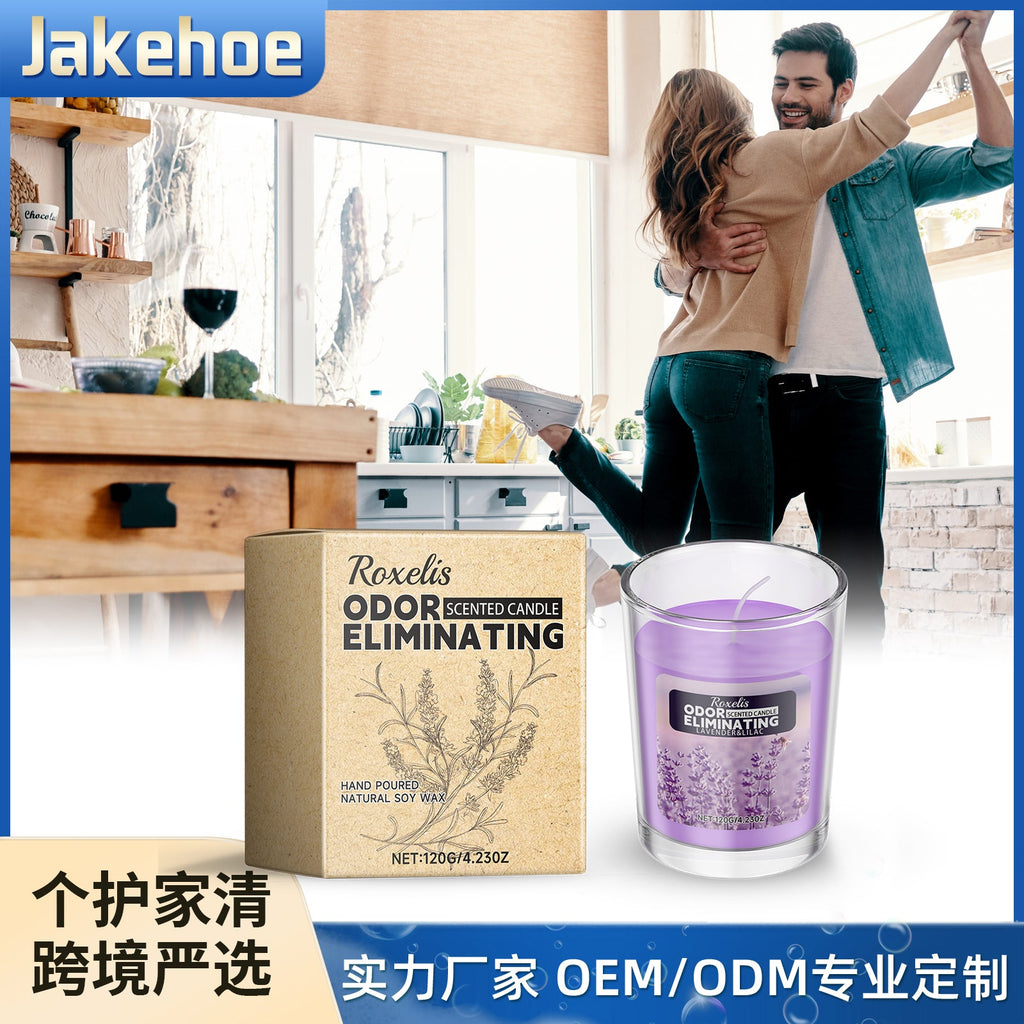 Lavender scented candle and gift box in a bright kitchen with joyful couple dancing together in the background