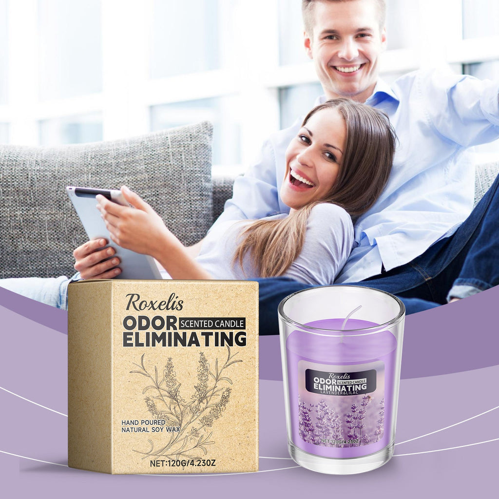 Happy couple relaxing on sofa with lavender scented candle displayed in the foreground